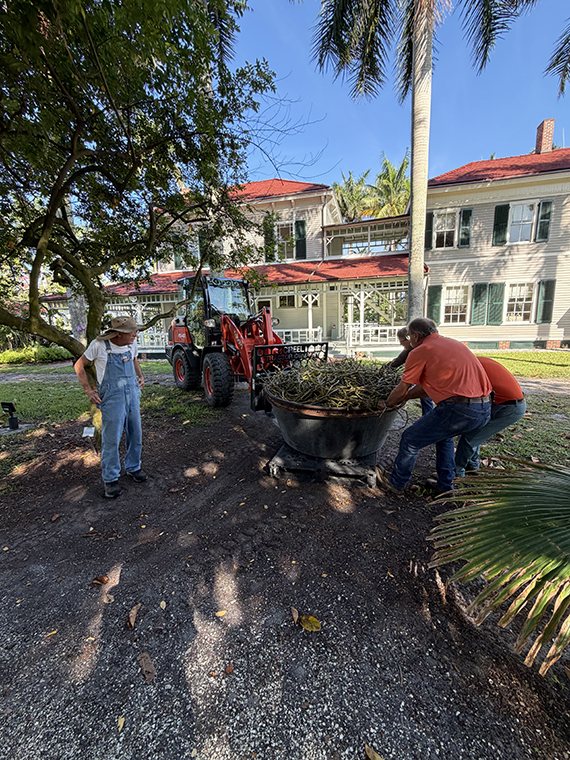 Robert Reifer watches the team with Creel Tractor move his 800-pound orchid into place in front of the historic Edison home.