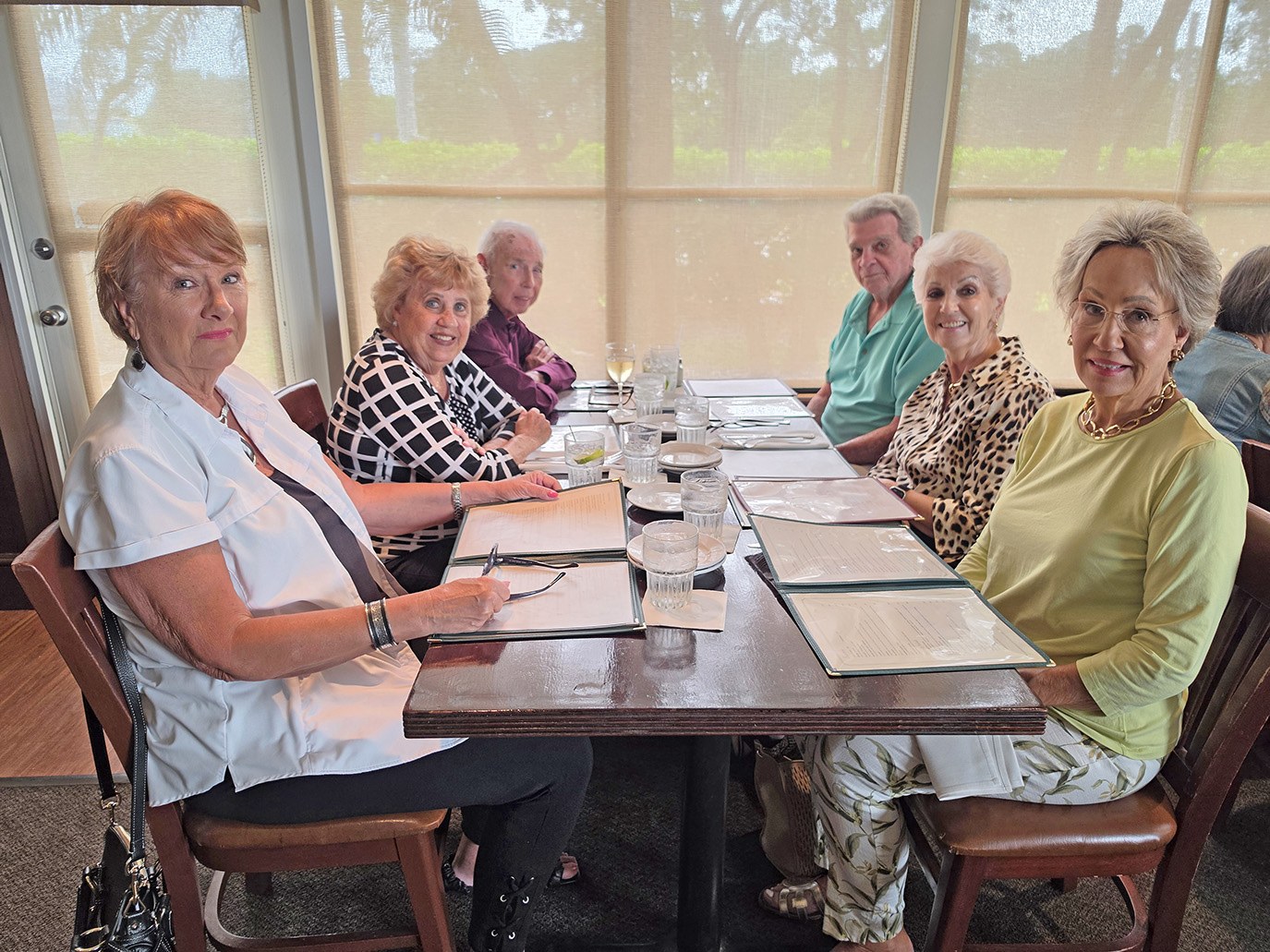 Gerry Varney, Debbie and Bill Wood, Leslie Duncan and the Montalbanos around a long table