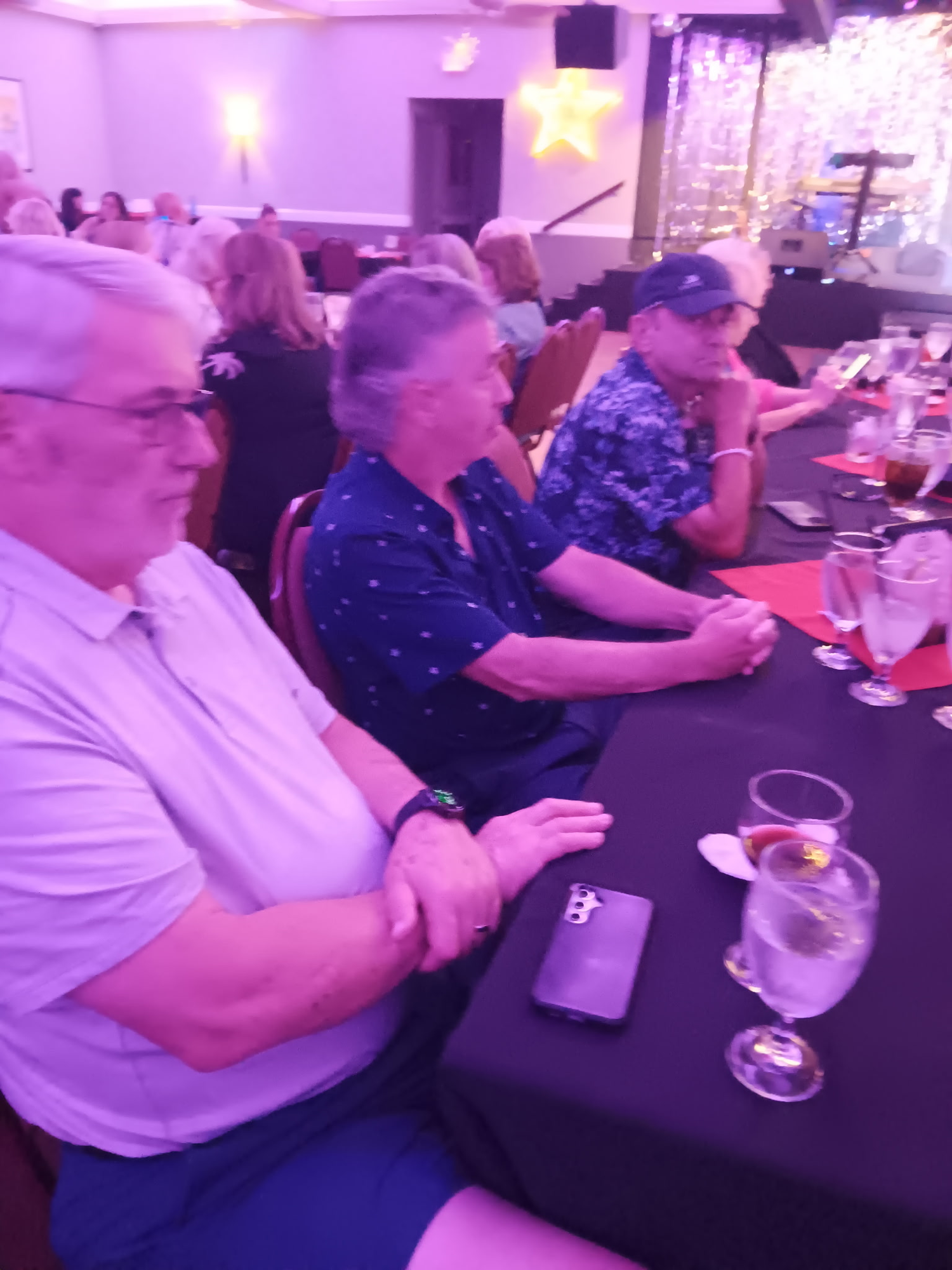 Bruce Kardon, Jeff Gleixner and Chandler Dugger seated at the Queen Tribute show