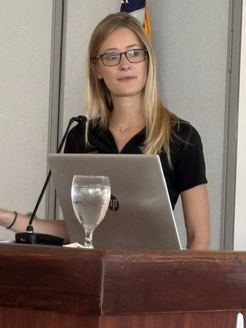 Victoria Staryk speaking at the podium during the Gateway Women’s Club meeting