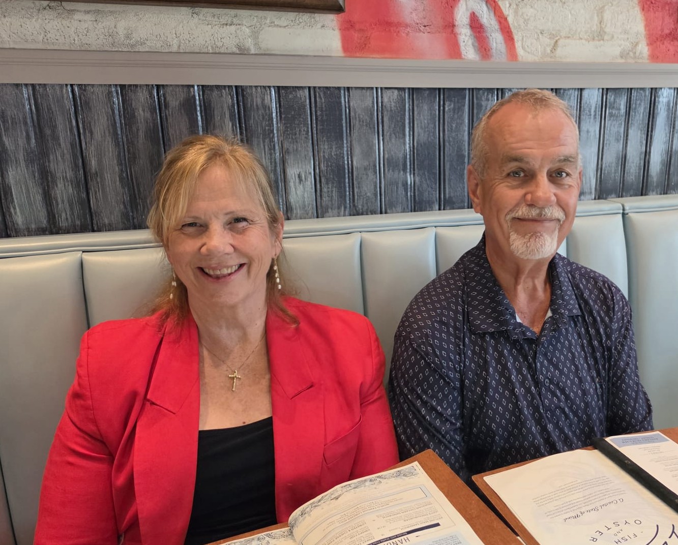A couple seated together at the restaurant